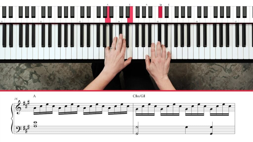 Overhead view of hands playing piano with notation underneath.